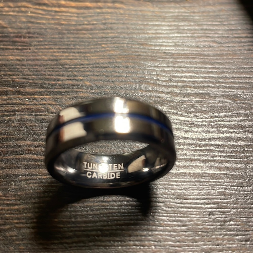 New tungsten carbide ring size 9. Silver or gunmetal blue stripenew